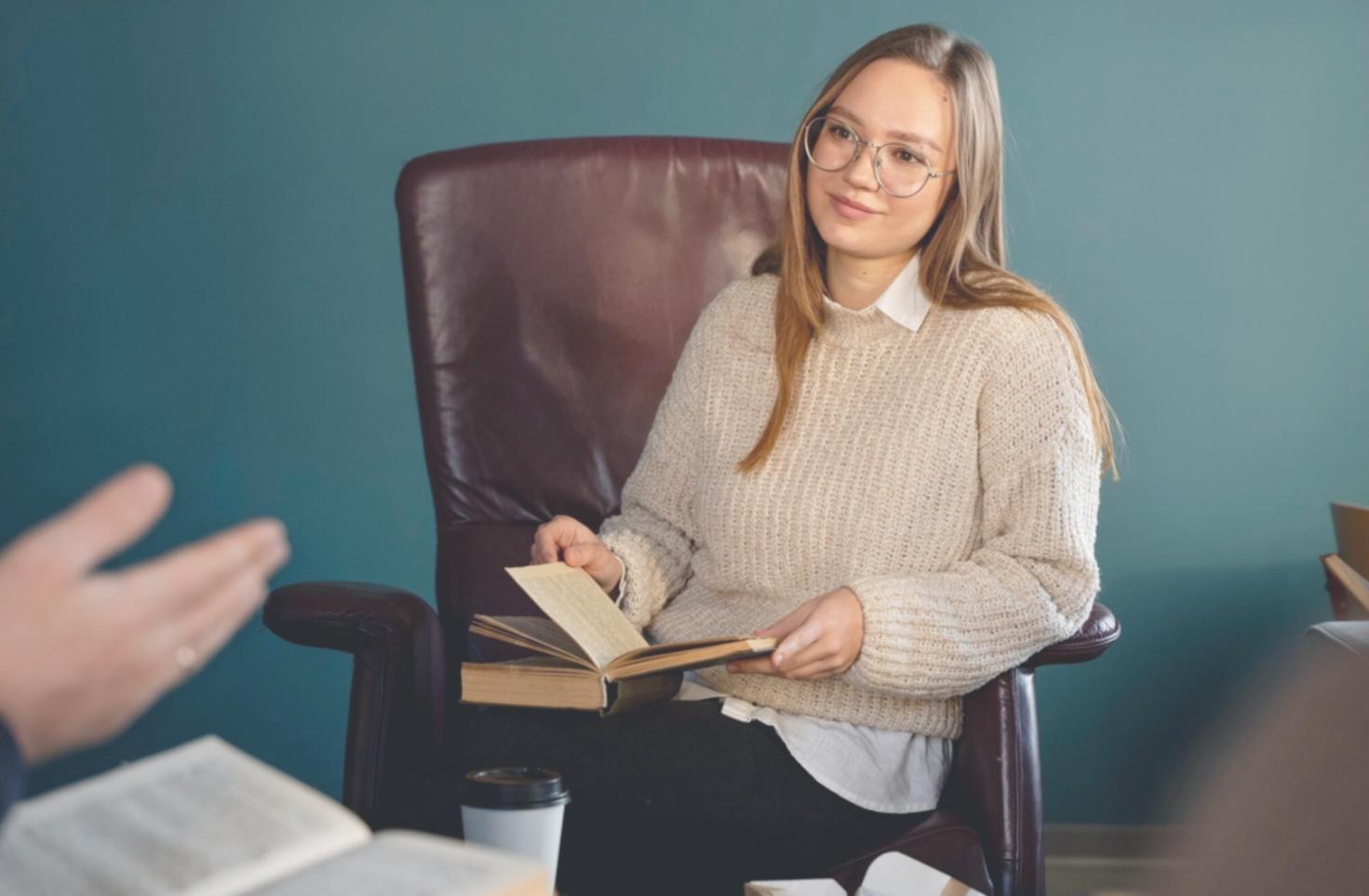 Person reviewing financial documents and statements at home office desk
