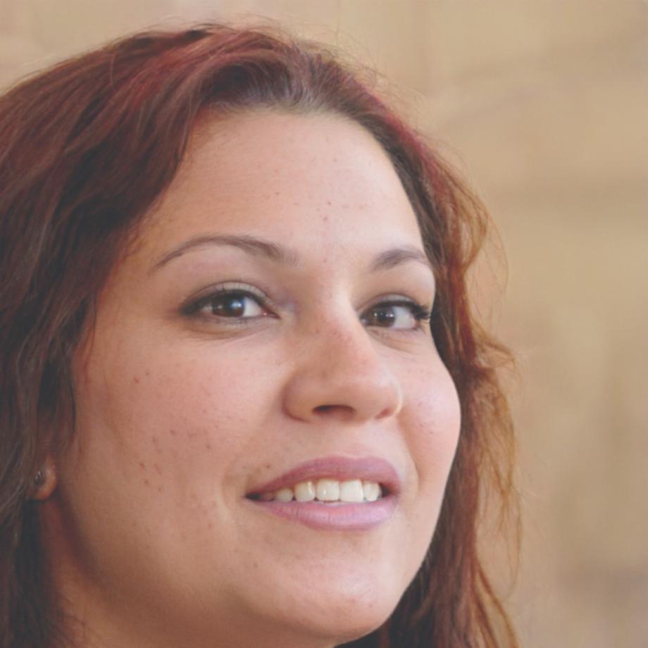 Professional woman smiling confidently in business attire